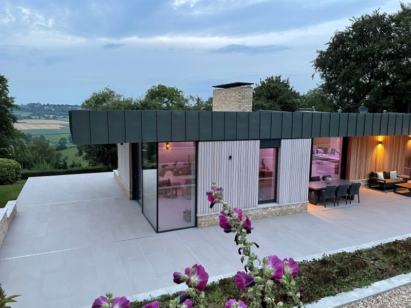 HF 410 Studio Windows, HS 330 Lift & Slide Doors in Timber-Aluminium with Glass-to-Glass Corner